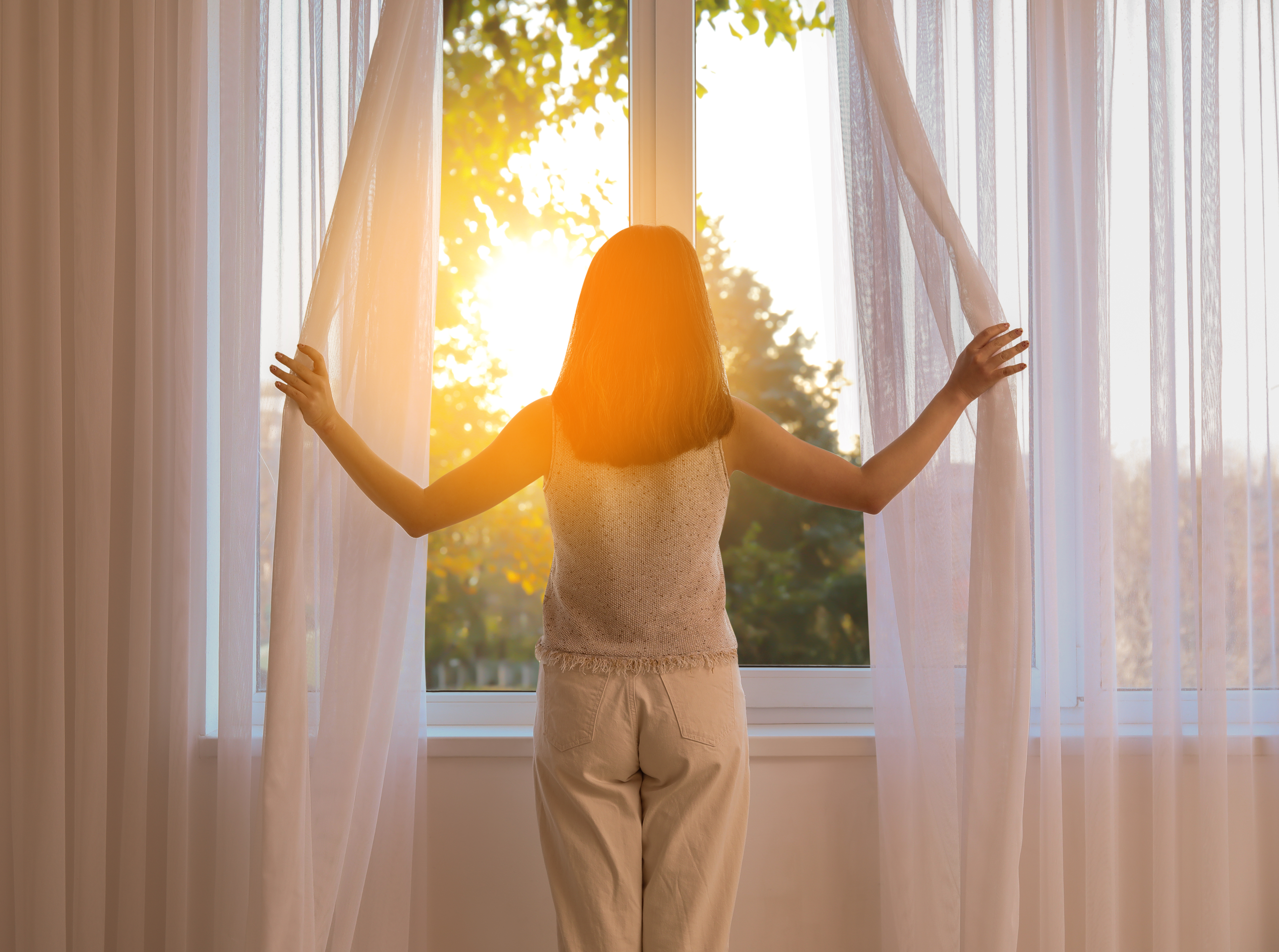 woman using curtains Bedfordshire